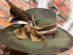 Western Green Hat Band For Festivals, Western Green Hat Bands For Festival, Green Western Style Hat Band For Festivals, Handmade Country Style Top Hat For Country Events, Distressed Bohemian Hat Band For Festivals, Distressed Bohemian Hat Bands For Festivals, Bohemian Distressed Hat For Rodeo, Custom Handmade Top Hat For Country Events, Bohemian Distressed Hat Bands For Festivals