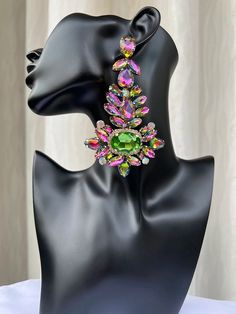 These earrings are definitely catchy and will take your outfit to the next level! They vibrant and popping are just what you need to dress up a casual look or add more pop to an already popping outfit. Comes in both fuchsia and green/pink combo. Eye-catching Dangle Earrings For Party, Eye-catching Drop Earrings For Party, Multicolor Crystal Earrings For Party, Glamorous Multicolor Crystal Earrings For Party, Drop Earrings For Spring Party, Summer Party Dangle Crystal Earrings, Summer Party Crystal Dangle Earrings, Spring Party Drop Earrings, Trendy Multicolor Crystal Earrings