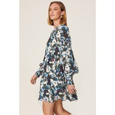 Blue floral crepe (100% Polyester) Empire. Crew neck. Long sleeves. Back zipper closure. 35" from shoulder to hemline. Imported. Long Sleeve Floral Print Mini Dress For Work, Chic Blue Floral Dress With Ditsy Print, Chic Blue Midi Dress With Ditsy Floral Print, Chic Blue Printed Floral Dress, Blue Printed Mini Dress For Fall, Floral Print Mini Dress For Work, Blue Floral Print Midi Dress For Work, Blue Floral Midi Dress For Work, Blue Floral Print Dress For Fall