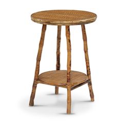 a small wooden table with a round top