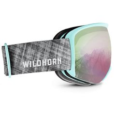 a pair of ski goggles sitting on top of a snow covered ground with the word wildhorn printed on it