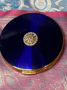 Beautiful vintage Mellisa Powder Compact deep blue with marcasite motif on the lid, fantastic condition. It shows very little wear, barely used. It comes with a dust cover to protect it.  It has its original powder sifter, and the mirror is perfect.  This is a lovely compact, ready to use in your handbag now. Art Deco Dresser, Compact Mirror Vintage, Dresser Set, Dusting Powder, Mirror Vintage, Beautiful Objects, Crystal Candlesticks, Dresser Sets, Powder Box