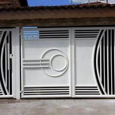 two white gates with circular designs on them