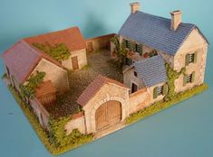 a model of a house is shown on a table