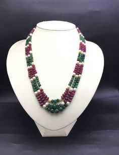 100% Natural Emerald / Natural Ruby / Genuine Pearl multi precious handcarved and smooth beaded necklace. Details: - Gemstones : Natural Emerald / Natural Ruby & Genuine Pearl Shape : Rondelle Strand : 3 Gross weight: 317.50 carats Net weight: 290.50 carats Calibration of beads: From 4.00MM till 9.50MM Length: Inner 16 Inches Outer 18 Inches SKU - MULTIBA004 100% NATURAL EMERALD HAND-CARVED RONDELLE SHAPE BEADS 100% NATURAL RUBY HAND-CARVED RONDELLE SHAPE BEADS 100% GENUINE PEARL SMOOTH ROUN Handmade Temple Jewelry Pearl Necklace With Round Beads, Traditional Double Strand Necklace As A Gift, Multicolor Briolette Gemstone Bead Necklaces, Multicolor Briolette Gemstone Beads Necklace, Festive Round Faceted Bead Necklaces, Festive Round Faceted Beads Necklace, Gift Pearl Necklace With Round Gemstone Beads, Gift Pearl Necklace With Gemstone Beads, Handmade Multicolor Round Pearl Necklace