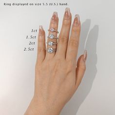 a woman's hand with three diamond rings on her left and two diamonds on the right