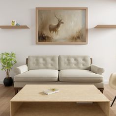 a living room filled with furniture and a painting on the wall above it's coffee table