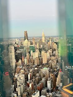 an aerial view of a city with skyscrapers and other tall buildings in the distance