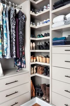 an organized closet with white drawers and lots of shoes