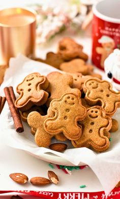 some cookies and cinnamon sticks on a table