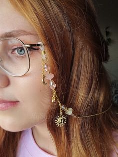 Elevate your eyewear game with our Pink and gold glasses chain featuring a stunning combination of rose quartz and yellow citrine crystals. This unique glasses chain is perfect for those who love celestial themes, as it features moon, star, and sun charms that will make you feel out of this world!  This eyeglass chain might be slightly heavier than regular chains because of some stone beads and crystals. Actual colors of any item or chains may slightly differ from screen to screen due to the screen resolution. I take our pictures in natural light during the day. If you want a custom request shoot us a message. We can make these crystal crowns and accessories with any of the crystals we have available (take a look at our shop to get an idea). Check out video footage of item on insta @myshin Affordable Adjustable Glasses Chains For Parties, Handmade Bohemian Glasses Chains, Glasses Chain Fashion, Glasses Chain Aesthetic, Fantasy Glasses, Crochet Glasses Chain, Paraguay Aesthetic, Eye Glass Chain, Eyeglasses Chains