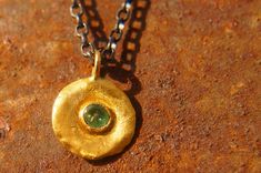 "solid 24k gold pendant//gold emerald necklace//emerald charm pendant//solid gold pendant//24k gold pendant//emerald charm//24k gold necklace 24k gold emerald pendant/charm size of pendant 10 mm approximately , (without the bail) emerald is a 3 mm facet stone. can come with a 14k chain 18\" (like in the image)with additional 100 us $ or with a 14k goldfield chain 18\" with additional 25 us $ or with an oxidized silver chain 18\" with additional 25 us $ I can make all sizes and add all gemstones, Gold Jewelry With Coin Pendant For May Birthstone, Gold Round Hallmarked Emerald Necklace, Gold Round Emerald Necklace Hallmarked, Gold Dainty Emerald Necklace, Dainty Gold Emerald Round Necklace, Gold Emerald Round Necklace, Gold Emerald Birthstone Necklace, Gold Jewelry With May Birthstone In Recycled Gold, Gold Jewelry With May Birthstone From Recycled Gold