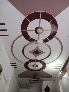 the ceiling is decorated with circles and shapes