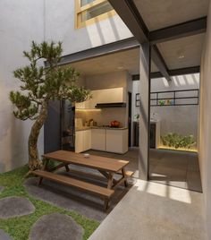 a table and bench in front of a house with an outdoor kitchen area on the other side