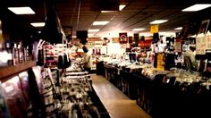 the inside of a record store filled with records