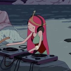 a woman with headphones is playing music on a turntable