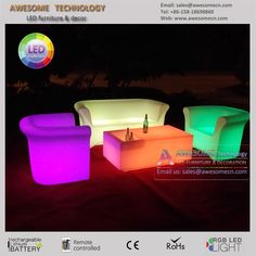 three different colored illuminated furniture in the dark