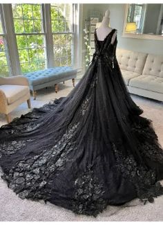 a black dress is on display in a living room