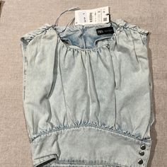 Zara Denim Top. Never Worn Chic Washed Denim Top For Day Out, Summer Light Wash Denim Top With Pockets, Chic Blue Washed Denim Top, Chic Medium Wash Denim Top For Summer, Chic Washed Denim Top In Denim Blue, Chic Washed Denim Blue Top, Light Indigo Summer Jeans, Summer Light Wash Washed Denim Top, Light Wash Denim Top For Summer