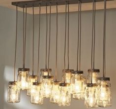 an image of a light fixture with mason jars hanging from it