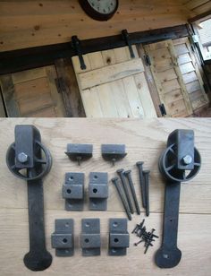 several pieces of metal sitting on top of a wooden floor next to a wall clock