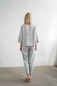 "When ordering you can choose to have the \"PANTS\" or \"TOP\" only or the whole \"PAJAMA SET\" of both items. When buying a set you save 5 euro. Comfortable relaxed fit EVA pajama pants in ice grey with pockets and fabric strap. Oversized CHLOE top in ice grey TOP: - length is ± 64 cm (25\") (depends on size) - wide mid-length sleeves - boxy fit BOTTOM: - outseam is ± 98 cm (38.5\") (depends on size) - inseam is ± 70 cm (27.5\") - elastic waistband with fabric strap - two side pockets DETAILS: Relaxed Fit Pant Set For Spring Pajama Party, Spring Sleepwear Sets In Relaxed Fit, Spring Relaxed Fit Pant Set For Pajama Party, Spring Sleepwear Sets With Relaxed Fit, Spring Season Relaxed Fit Sleep Sets, Casual Relaxed Fit Pant Set For Daywear, Relaxed Fit Casual Pant Set For Daywear, Oversized Long Sleeve Sets For Daywear, Oversized Spring Loungewear Sets