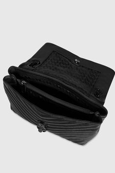 A classic in the making. The Edie Flap Shoulder bag, crafted in quilted genuine leather, toes the line between practical and glamorous. Style #: X F18MEQD37 100% Genuine Leather Black Shellac Hardware 12" W X 7" H X 3. 50" D 11-21" Strap Magnetic Snap Closure 1 Exterior Back Slip Pocket Triple Compartment with Center & Back Wall Zip Imported The photos featuring a model are for size reference only. Actual color and material may vary from what is depicted. | Rebecca Minkoff Edie Flap Shoulder Bag Black Shellac, Rebecca Minkoff Crossbody Bag, Convertible Crossbody Bag, Flap Shoulder Bag, Rebecca Minkoff Bag, Quilted Crossbody Bag, Chevron Quilt, Black Crossbody, Black Hardware