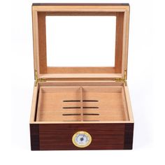 an open wooden box with a clock inside