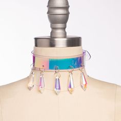 Magical, color-shifting iridescent oversized choker collar made in thick PVC. Holographic, iridescent pvc is layered over clear or white PVC. Aurora borealis glass crystal points adorn the front. Fit is adjustable with buckle in back. Inspired by Sailor Moon and Magical Girls! Collar is 1.5" wide. SMALL/MEDIUM (11-13")MEDIUM/LARGE (13-15")LARGE/X-LARGE (15-17") Custom sizing available. All pieces are MADE TO ORDER, standard sizes XS-XL. If your measurements fall outside these standards or you ar Iridescent Clothing, Holographic Choker, Posture Collar, Holographic Iridescent, O Ring Choker, High Aesthetic, Rave Gear, Kawaii Clothing, Harness Bra