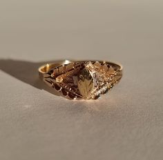 A lovely little vintage signet ring with the shield shaped and engraved to look like a little leaf. Made in 14k gold and size Ø18,3 mm/US 8,25. The signet plate measures 6,3*3,7 mm. Shank width 8,3-1,9 mm and the motif comes 2,5 mm off the finger when wearing. There are hallmarks on the outside of the shank. Very good vintage condition, the engraving on the signet is somewhat faint but other than that there is barely any wear. Remember: Vintage and antique jewelry are sustainable, eco-friendly a Luxury Vintage Open Signet Ring, Vintage Tarnish-resistant Signet Ring For Promise, Vintage Oval Signet Ring With Diamond Cut, Vintage Tarnish Resistant Signet Ring For Promise, Vintage Oval Diamond Cut Signet Ring, Vintage Oval Signet Ring, Tarnish Resistant, Vintage Tarnish-resistant Signet Ring For Wedding, Vintage Tarnish Resistant Signet Ring For Weddings, Vintage Wedding Signet Ring Tarnish Resistant