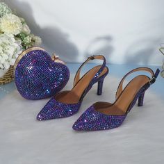 Now you will take your wedding shoes with your, leaving behind a heart shaped bag in the wedding photo booth. These are the most chic shoes while looking like you have been wearing them for years! This product is exclusive, like nobody else. With our classic wedding shoes, you can make a confident entrance on your big day. These are available in many colors and styles, so you can find exactly what you're looking for. Also, with our heart-shaped bag, you'll be able to carry your gear with 1 hand! Wedding Shoes Round Toe For Party Season, Wedding Shoes With Round Toe, Round Toe Wedding Shoes For Party Season, Ankle Strap Wedding Shoes For Party Season, Round Toe Heels For Valentine's Day Formal, Elegant Open Toe Heels For Valentine's Day, Chic Champagne Wedding Shoes For Evening, Purple Wedding Shoes For Party, Glamorous Purple Heels For Wedding