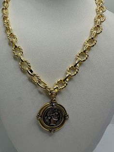 Our gold plated chain is made the highest quality We use gold filled components. 14K Gold plated  thick textured Shape link chain with Antique Bronze gold plating vintage medallion coin The vintage thick gold plated  necklace has a  long lasting color retention The necklace can be made in 18 Inches or 20 inches This chic Gold Chunky necklace gives a sophisticated look with any outfit! Gold Coin Necklace With Figaro Chain Pendant, Gold Coin Pendant Necklace With Figaro Chain, Gold-plated Tarnish-resistant Toggle Necklace, Gold-tone Gold Plated Chain Necklace With Coin Pendant, Gold-tone Coin Pendant Chain Necklace, Metal Figaro Chain Necklace, Gold Plated Chunky Chain Necklace, Gold Metal Chain Necklace With Coin Pendant, Gold Plated Coin Necklace With Figaro Chain