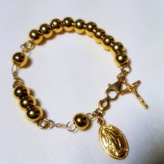 I do not accept off-site ads order. This bracelet has designed by Korean sister for her mother. Her mother lost his husband 2 months ago so daughter want to give some special gift as a Catholic. 24k gold 6mm ball has weaved by 18k solid gold wire. Crucifix and miraculous medal are 999% gold purity of 24k gold. For the safety reason, I am using 18k gold clasp,18k gold chain. Express tracking parcel will be used for delivery. If customer want lower cost and no taxes, please use my local webstore. Gold Rosary, Solid Gold Charms, Wedding Ring Diamond Band, Solid Gold Bracelet, 18k Gold Chain, Rosary Bracelet, White Diamond Ring, Gold Charm Bracelet, Miraculous Medal