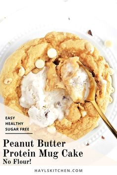 peanut butter protein mug cake on a white plate with a gold spoon and text overlay