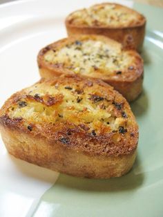 three pieces of bread sitting on top of a white plate