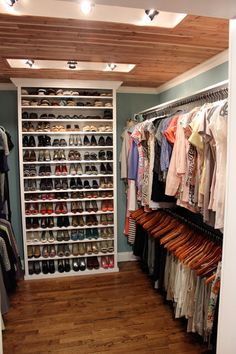 the closet is full of clothes and shoes