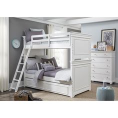 a white bunk bed with drawers underneath it