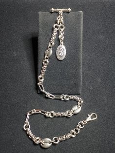 Upgrade your pocket watch with this stylish stainless steel chain, meticulously crafted for durability and sophistication. Made from high-quality stainless steel, with this chain exudes sophistication and class, making it the perfect accessory for any pocket watch enthusiast. The 37.25cm long chain provides ample length for easy attachment to your pocket watch, while the sturdy swivel lobster claw clasp ensures secure fastening. Its timeless design makes it suitable for various occasions, from e Classic Silver Metal Pocket Watch, Timeless Silver Metal Pocket Watch, Silver Metal Pocket Watch For Formal Occasions, Luxury Silver Jewelry With Chain Strap, Formal Stainless Steel Silver Chain Bracelet, Silver Jewelry With Oval Link Chain Strap, Elegant Silver Metal Pocket Watch, Classic Silver Jewelry With Chain Strap, Formal Stainless Steel Oval Link Chain Necklace