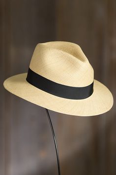 Our dapper panama is poised for sunny days. Made of 100% panama straw from Ecuador, this timeless safari features a 1" grosgrain ribbon finished with a bow and pin, and a 2.5" brim for shade and style. This warm-weather favorite has a twill interior sweatband that ensures comfort and fit. Made in the USA. Fur Hats, Safari Hat, Men's Hats, Western Hats, Women's Hats, Cool Hats, Womens Clothing Stores, Handbag Shoes, Earmuffs