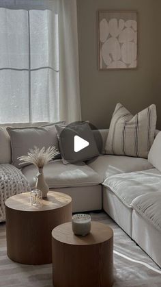 a living room filled with furniture and pillows