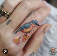 a small bird tattoo on the ring finger is one of the most popular tattoos for women