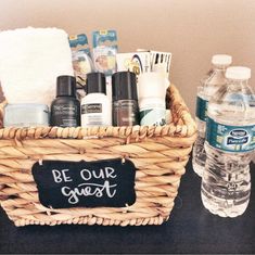 a basket filled with personal care items next to a bottle of water