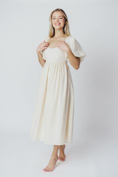 The Hamilton is everything you're looking for in a midi dress - charming, sophisticated, and absolutely flattering. It features premium quality details, like a sweetheart neckline and gorgeous balloon sleeves that can be worn on or off the shoulder. It's an unforgettable choice for every body type, and extra-comfy for expecting mamas! The best part? You can wear this beauty long after your sweet baby arrives! Available in multiple colorways. FIT: Runs true to size. Features a smocked back panel Feminine Puff Sleeve Dress With Sweetheart Neckline, Elegant Midi Dress For Brunch, Spring Midi Dress With Sweetheart Neckline For Brunch, Midi Dress With Ruched And Fitted Bodice For Brunch, Feminine Puff Sleeve Dress With Ruched Bodice, Feminine Cream Midi Dress For Garden Party, Chic Cream Puff Sleeve Knee-length Dress, Spring Brunch Puff Sleeve Dress With Sweetheart Neckline, Chic Midi Dress With Balloon Gathered Sleeves