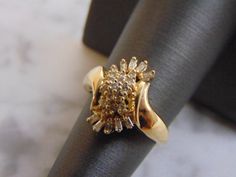 FOR SALE IS THIS WONDERFUL WOMENS 14K YELLOW GOLD DIAMOND CLUSTER RING. THE RING WEIGHS 5.0g, AND IS A SIZE 6.5. THERE ARE ABOUT .54cts OF DIAMONDS IN THIS RING. ANY QUESTIONS PLEASE DO NOT HESITATE TO ASK. BE SURE TO CHECK OUT SOME OF MY OTHER GREAT ITEMS UP FOR SALE. THANK YOU. Gold Cluster Ring With Vs Clarity, Diamond Cluster Ring, Diamond Cluster, New People, Cluster Ring, Gold Diamond, Cuff Bracelets, Jewelry Watches, Jewelry Rings