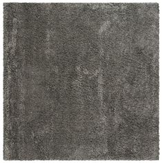 an area rug with grey shag on it