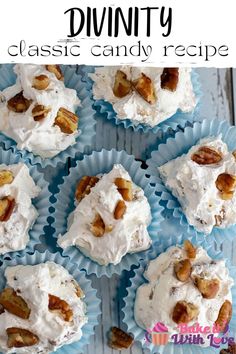 several cupcakes with white frosting and walnuts on the top are arranged in blue paper muffin cups