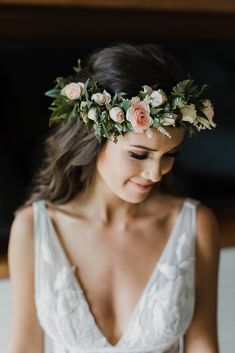 a woman wearing a flower crown on her head