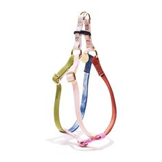 three different colored leashes on a white background