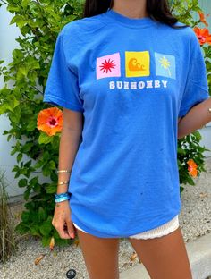 Our *EXCLUSIVE* Sunhoney Daydream T-shirt in Ocean Blue is giving all the Sunhoney vibes!! This designed was designed by us and only available through us!! This design features our favorite summer time icons in playful color combinations. This design is printed on Comfort Colors t-shirt so you know it's going to be super comfy! Style this sweatshirt with your fave boxer shorts, denim or leggings all year round! Product is made to order: available for pick up/ships in 2-4 business days Designed b Retro Printed Summer T-shirt, Retro Summer T-shirt With Front Print, Blue Beach T-shirt With Front Print, Trendy Blue Pre-shrunk T-shirt, Trendy Graphic Print T-shirt For Summer Adventures, Trendy Summer T-shirt With Front Print, Cute Summer Printed T-shirt, Blue Cotton T-shirt For Summer, Blue Short Sleeve Summer T-shirt