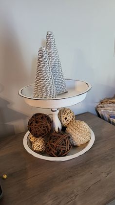 three tiered tray with decorative items on it